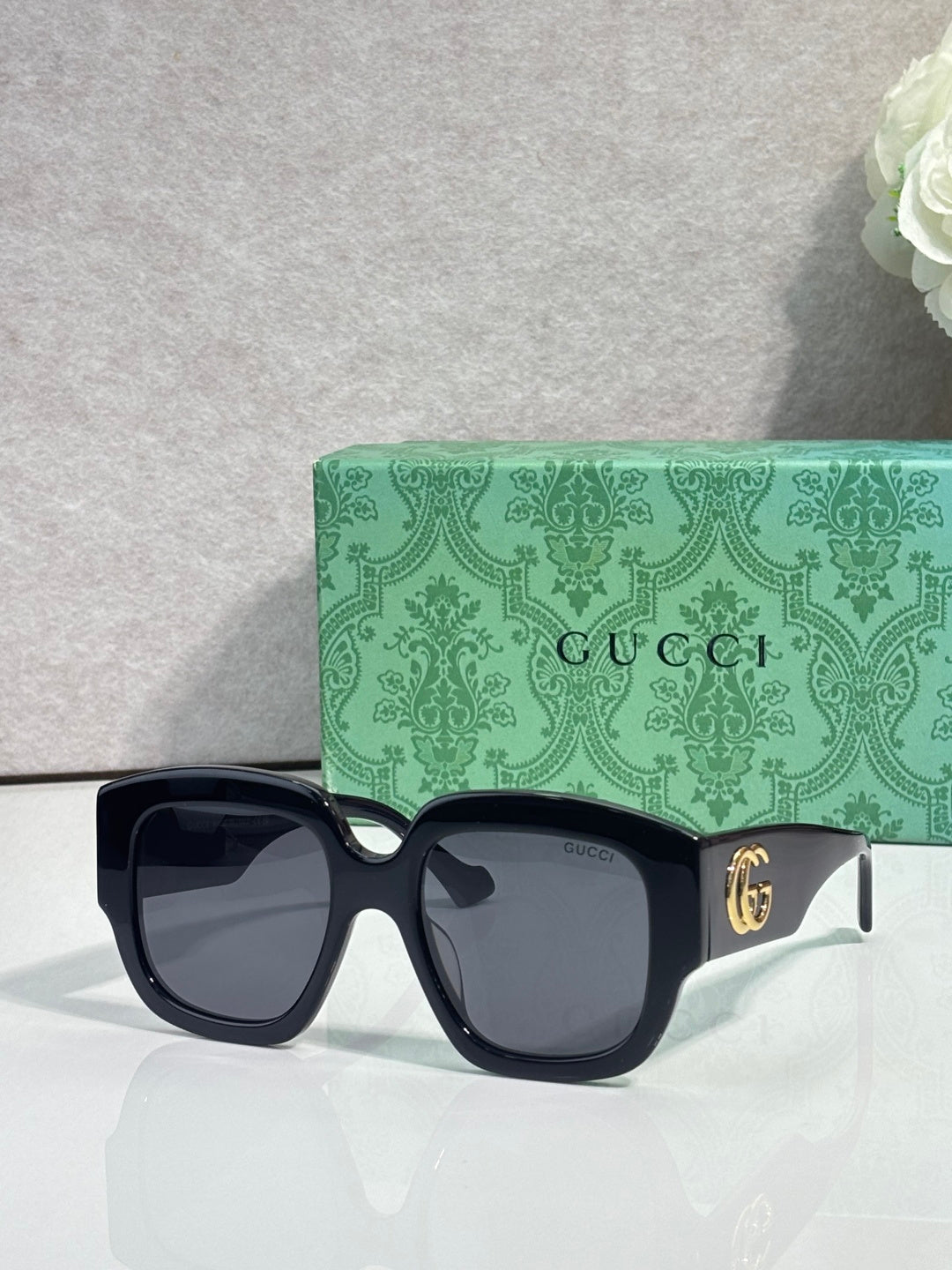 Gucci square sunglasses with dark tortoiseshell frame and black lenses