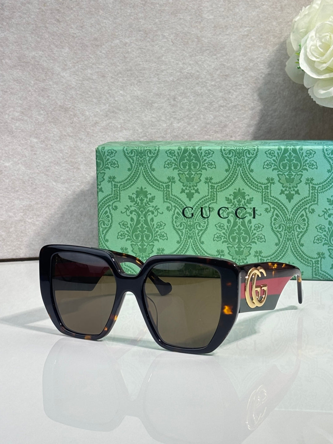 Gucci tortoiseshell square sunglasses with gold double-G temple detail