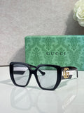 Gucci dark green square sunglasses with gold logo on temples and clear lenses