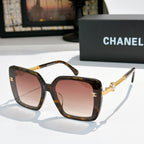 Dark tortoise square sunglasses with pink-tinted lenses and gold chain temples