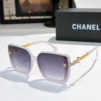 Light lilac square sunglasses with purple lenses and gold chain temple accents