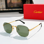 Gold-tone sunglasses with green lenses and black temple arms.