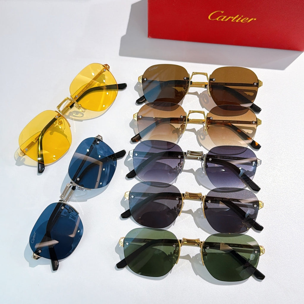 Assorted sunglasses with mixed gold frames and tinted lenses in blue, brown, and green.