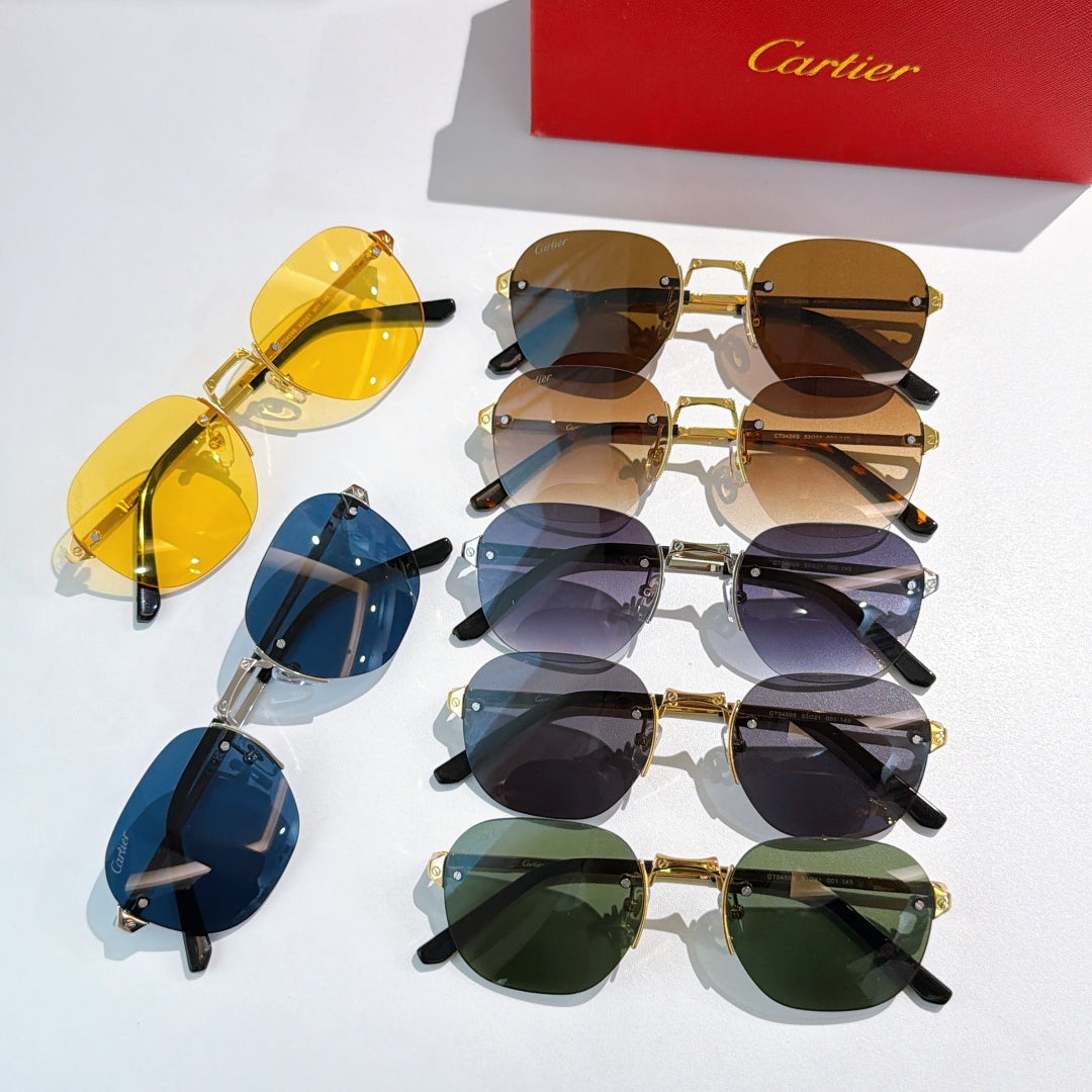 Assorted sunglasses with mixed gold frames and tinted lenses in blue, brown, and green.