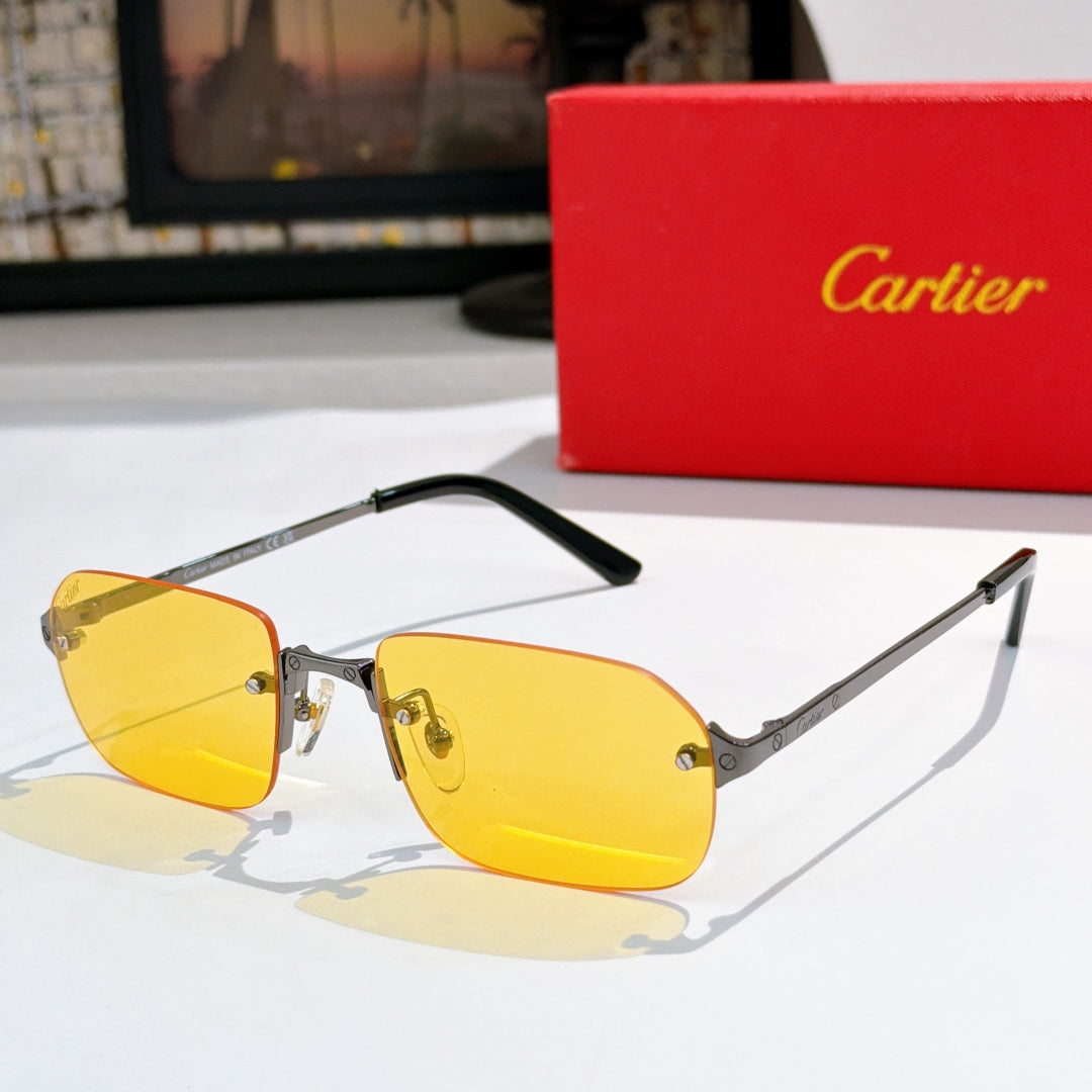 Cartier sunglasses with black frames, gold temples, yellow tinted lenses