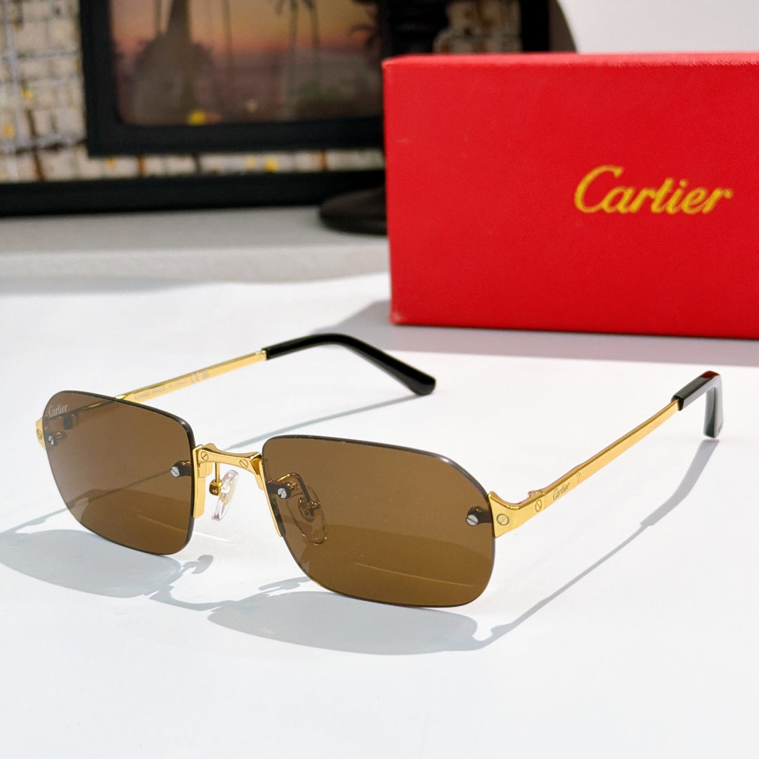 Cartier sunglasses with gold frames, black tips, brown tinted lenses