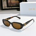 Dior sunglasses, dark tortoise frames with amber tinted lenses