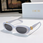 Sunglasses with light blue frames and dark tinted lenses