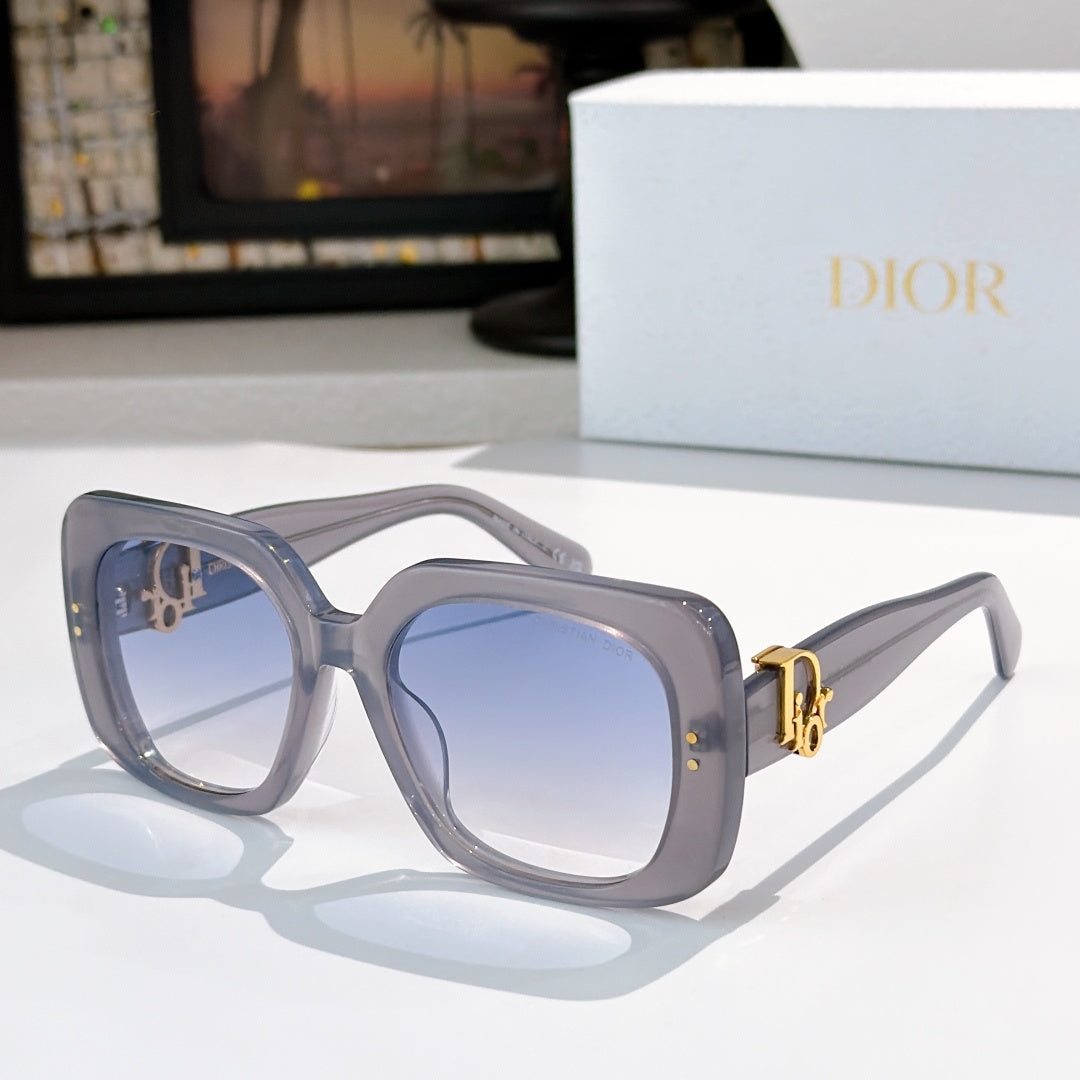 Light gray-blue sunglasses with square lenses and gold logo hinge detail