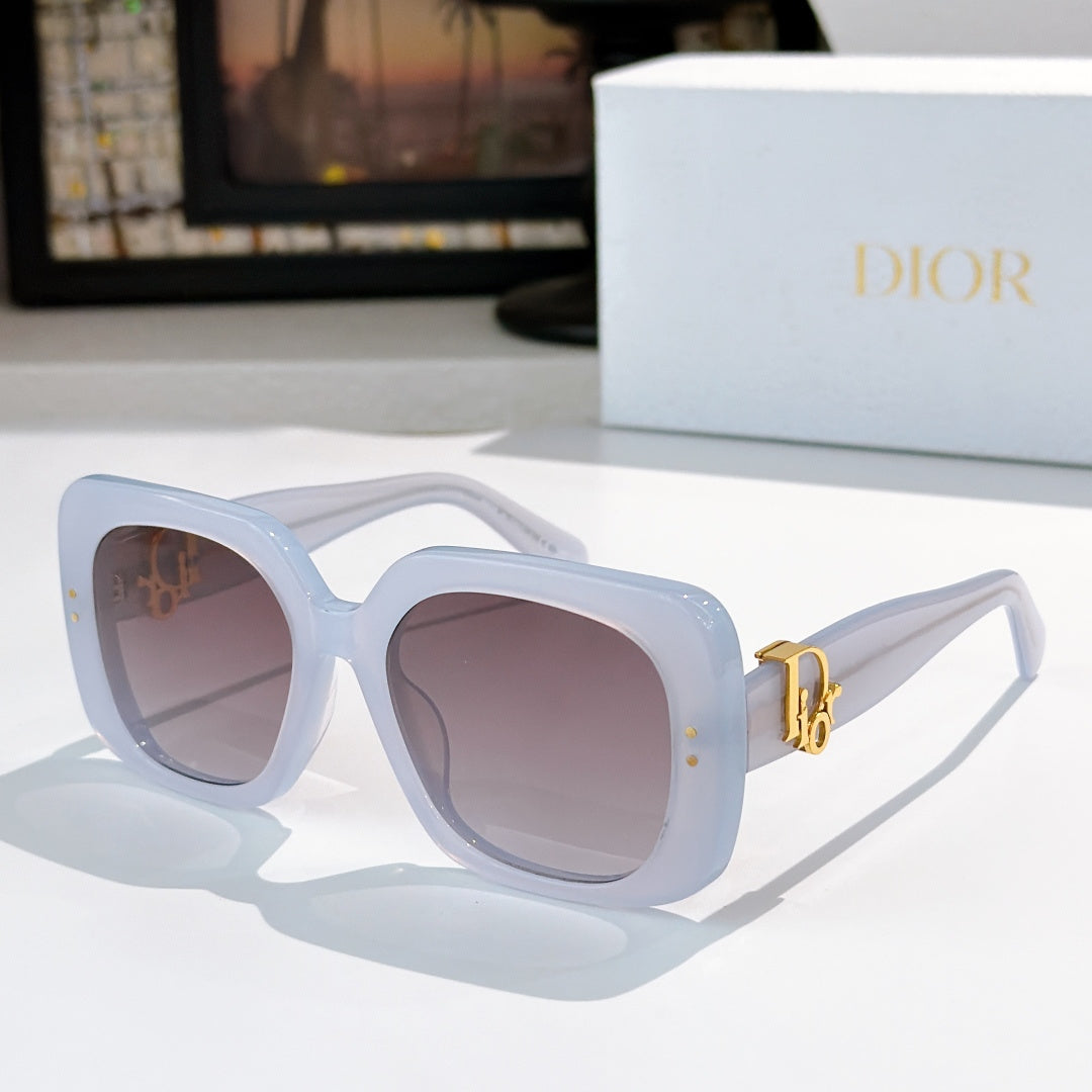 Light blue sunglasses with square lenses and gold logo hinge detail