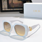 Light blue sunglasses with square lenses and gold logo hinge detail