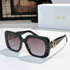 Black sunglasses with square lenses and gold logo hinge detail