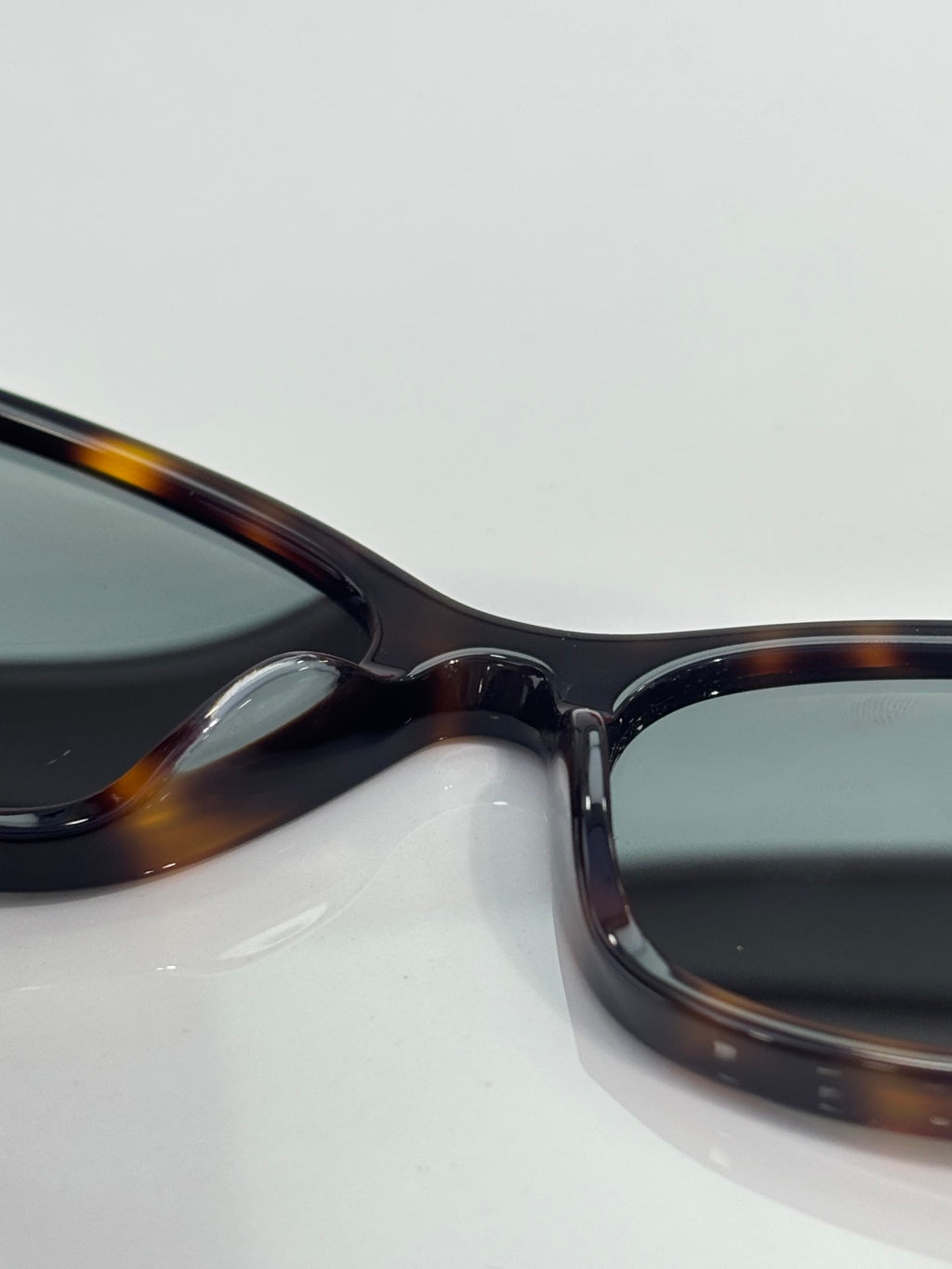 Tortoiseshell sunglasses temple and hinge close-up