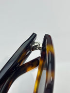 Tortoiseshell sunglasses hinge detail in close-up