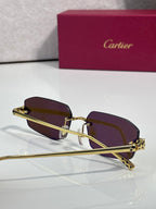 Cartier gold-tone sunglasses with dark maroon lenses