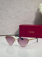 Cartier gold metal eyeglasses with black temples, purple-tinted lenses, cat-eye style