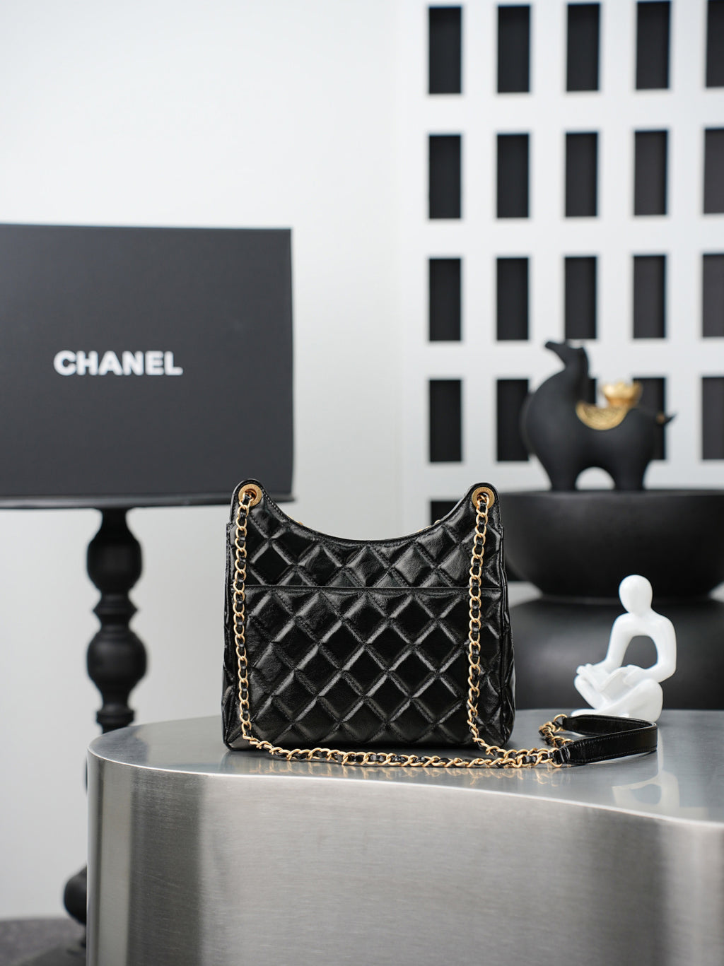 Quilted Chanel bag with gold chain shoulder strap, black quilted diamond pattern
