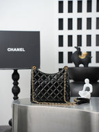 Quilted Chanel bag with gold chain shoulder strap, black quilted diamond pattern