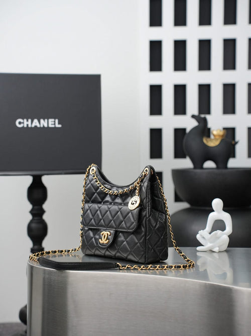Chanel quilted shoulder bag with gold chain, CC plaque, and pocket front