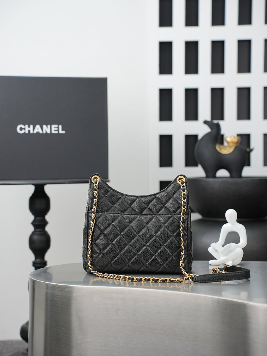 Chanel quilted shoulder bag with gold chain strap and dark quilted front