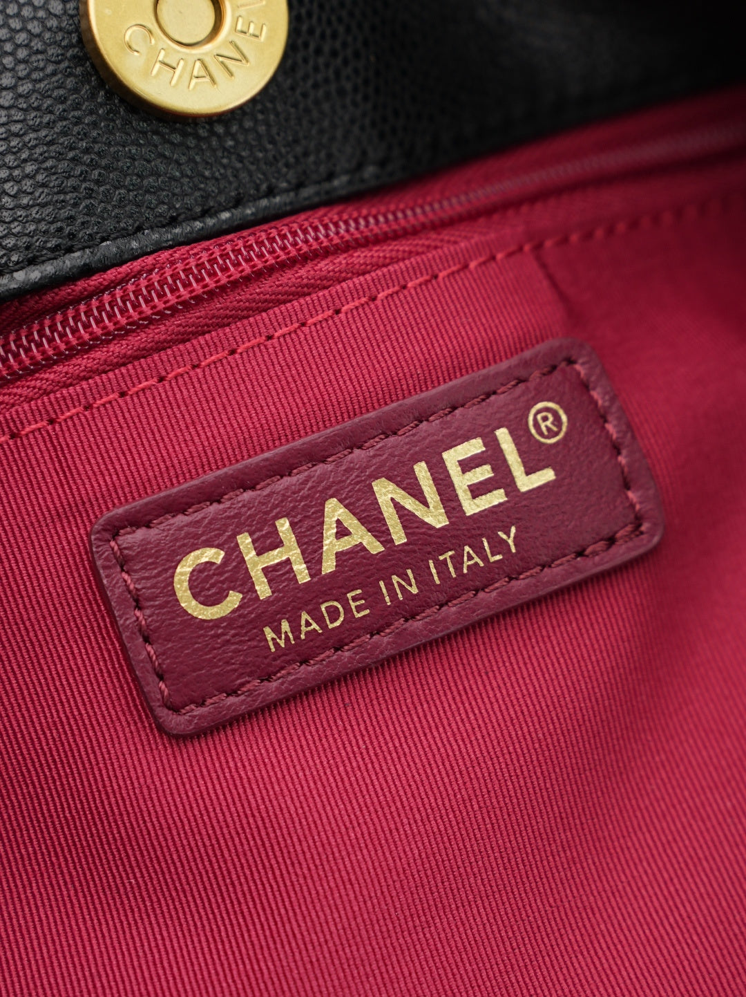 Chanel Made in Italy label on burgundy lining inside the bag