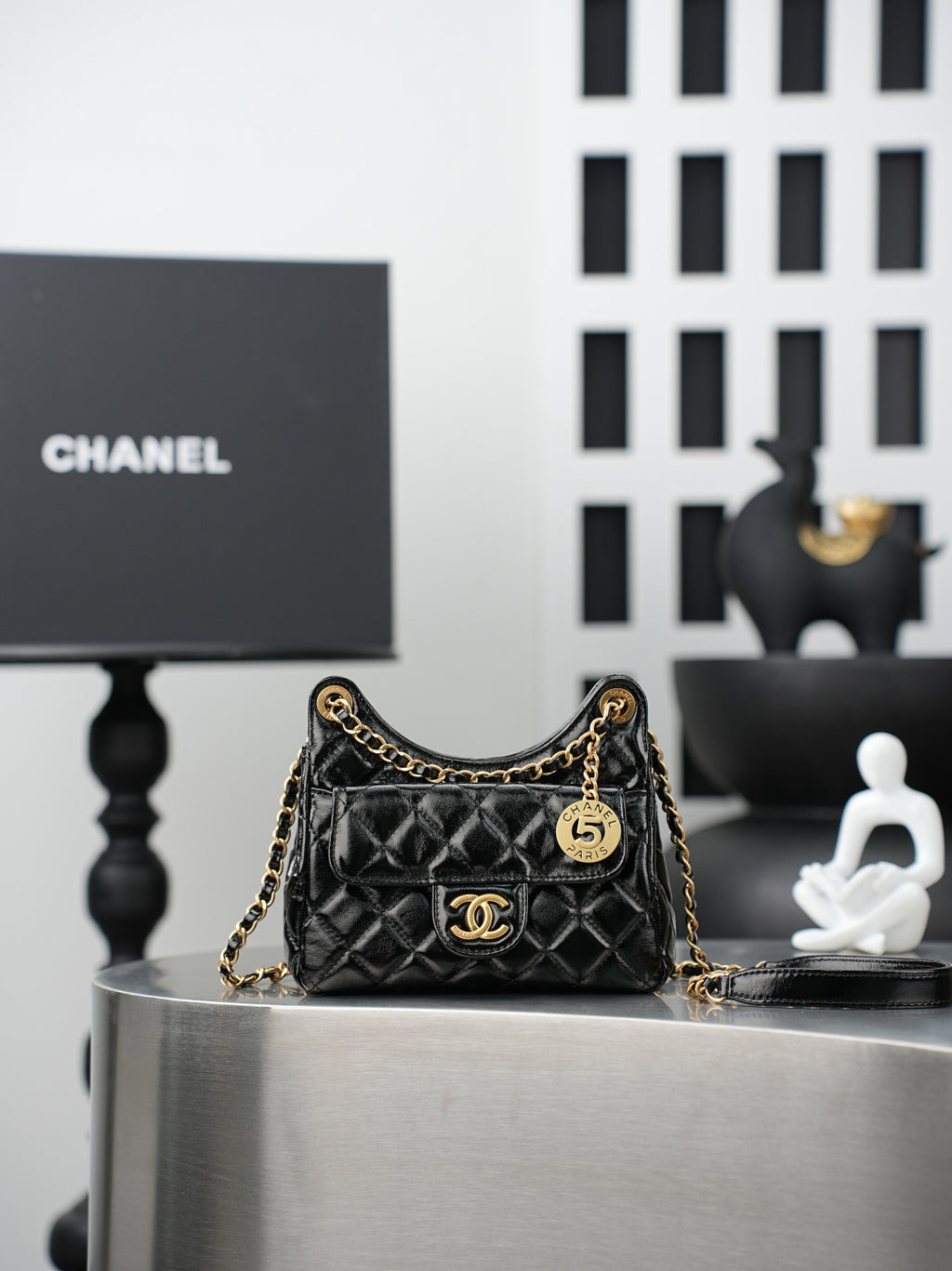 Chanel quilted black bag with gold chain strap and CC flap logo