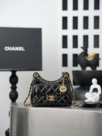 Chanel quilted black bag with gold chain strap and CC flap logo