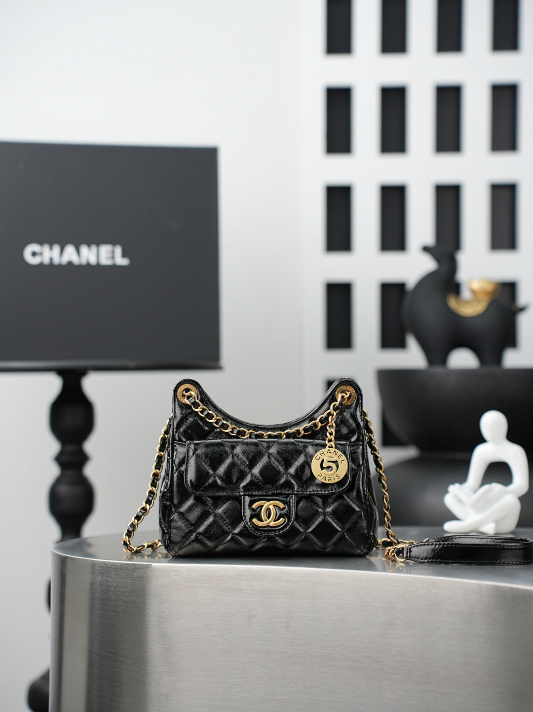 Chanel quilted black bag with gold chain strap and CC flap logo