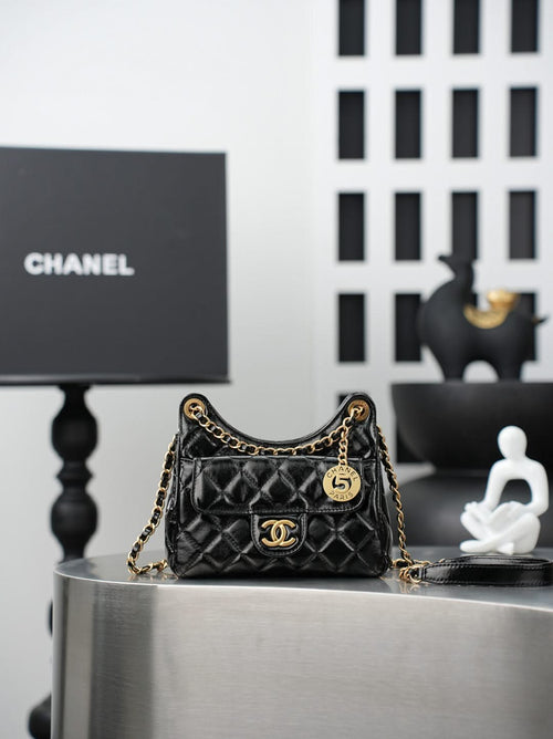 Chanel quilted black bag with gold chain strap and CC flap logo
