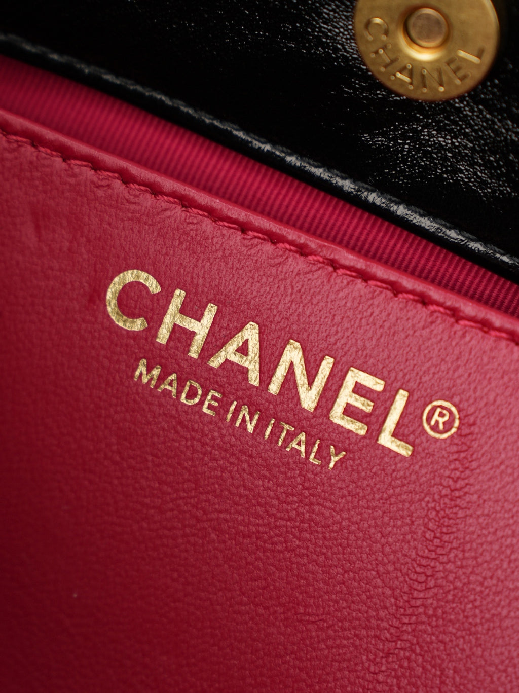 Chanel Made in Italy on red fabric lining inside the bag