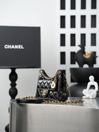 Chanel quilted black mini bag with gold chain shoulder strap and CC clasp