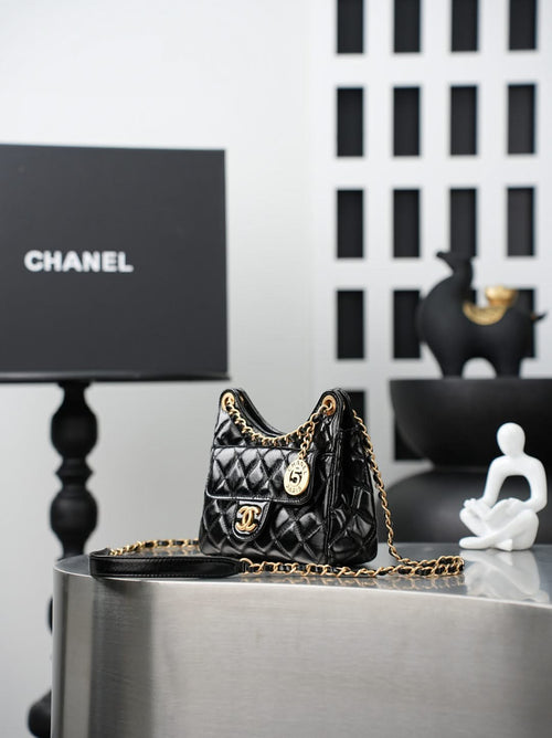 Chanel quilted black mini bag with gold chain shoulder strap and CC clasp