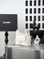 Chanel quilted mini shoulder bag in white with gold chain and front flap