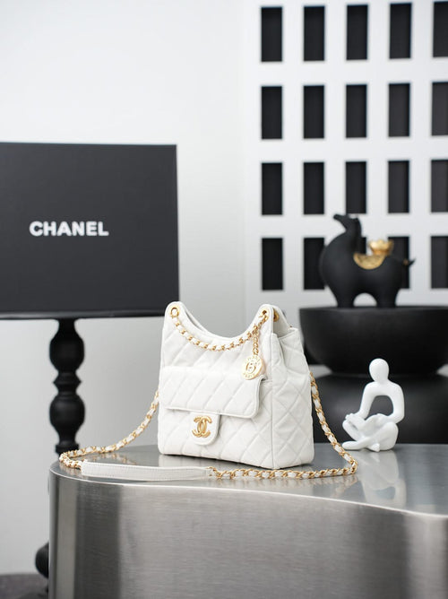 Chanel quilted mini shoulder bag in white with gold chain and front flap