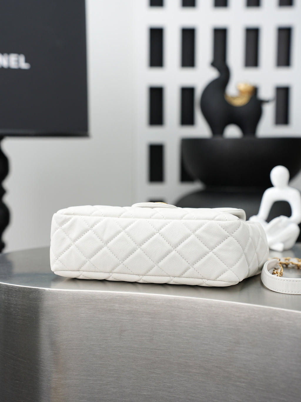 Chanel quilted white shoulder bag with braided gold chain strap and flat base