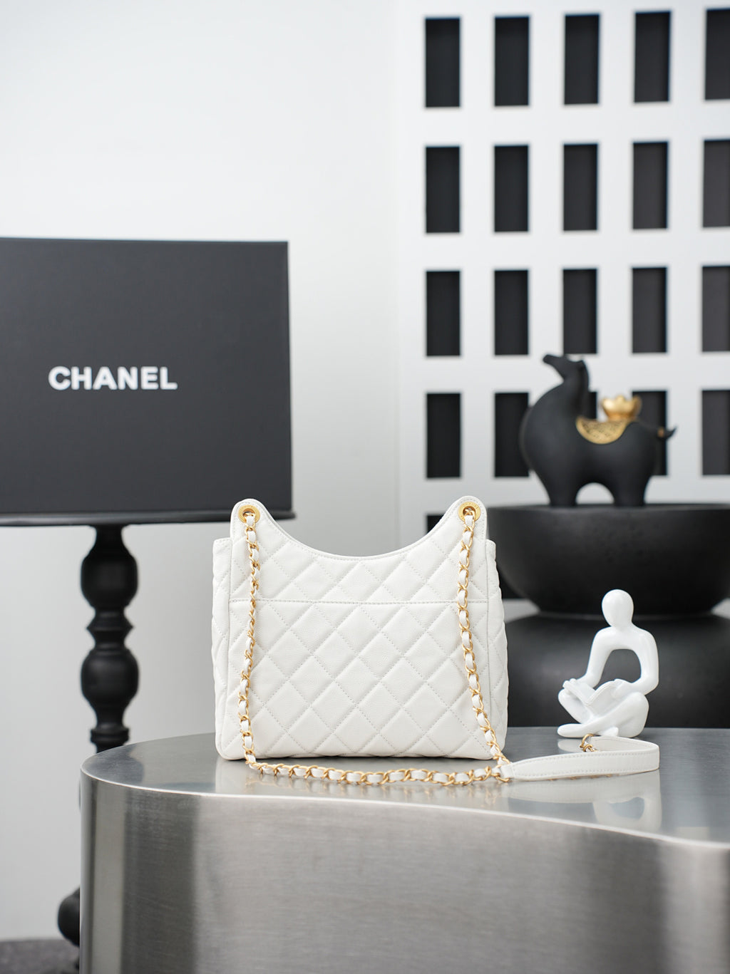 Chanel quilted shoulder bag in white with gold chain strap and top handle loops