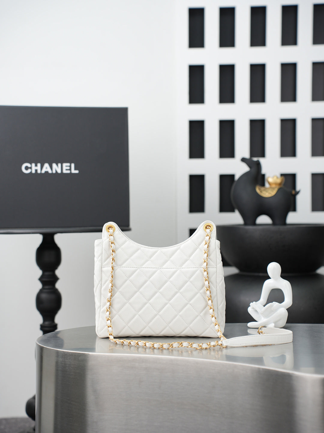 Chanel quilted shoulder bag in white with gold chain strap and top handle loops