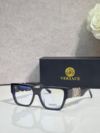 Versace eyeglasses with dark blue frames, clear lenses, and metallic temple emblem