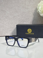 Versace eyeglasses with dark blue frames and clear lenses with metallic temple emblem