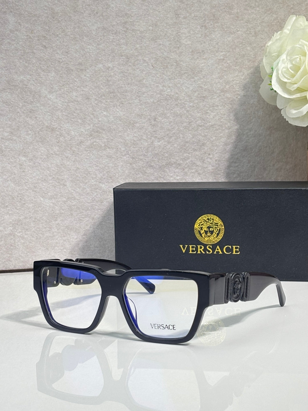 Versace eyeglasses, dark blue frames with clear lenses and gold temple logo