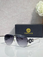 Versace pilot sunglasses, dark navy tinted lenses, gold-tone metal frame