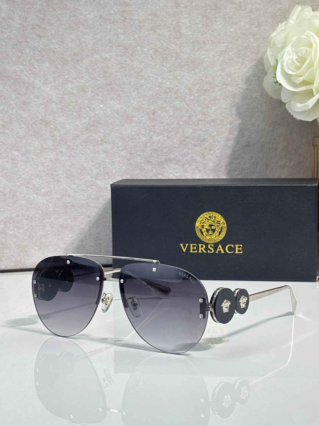 Versace pilot sunglasses, dark navy tinted lenses, gold-tone metal frame