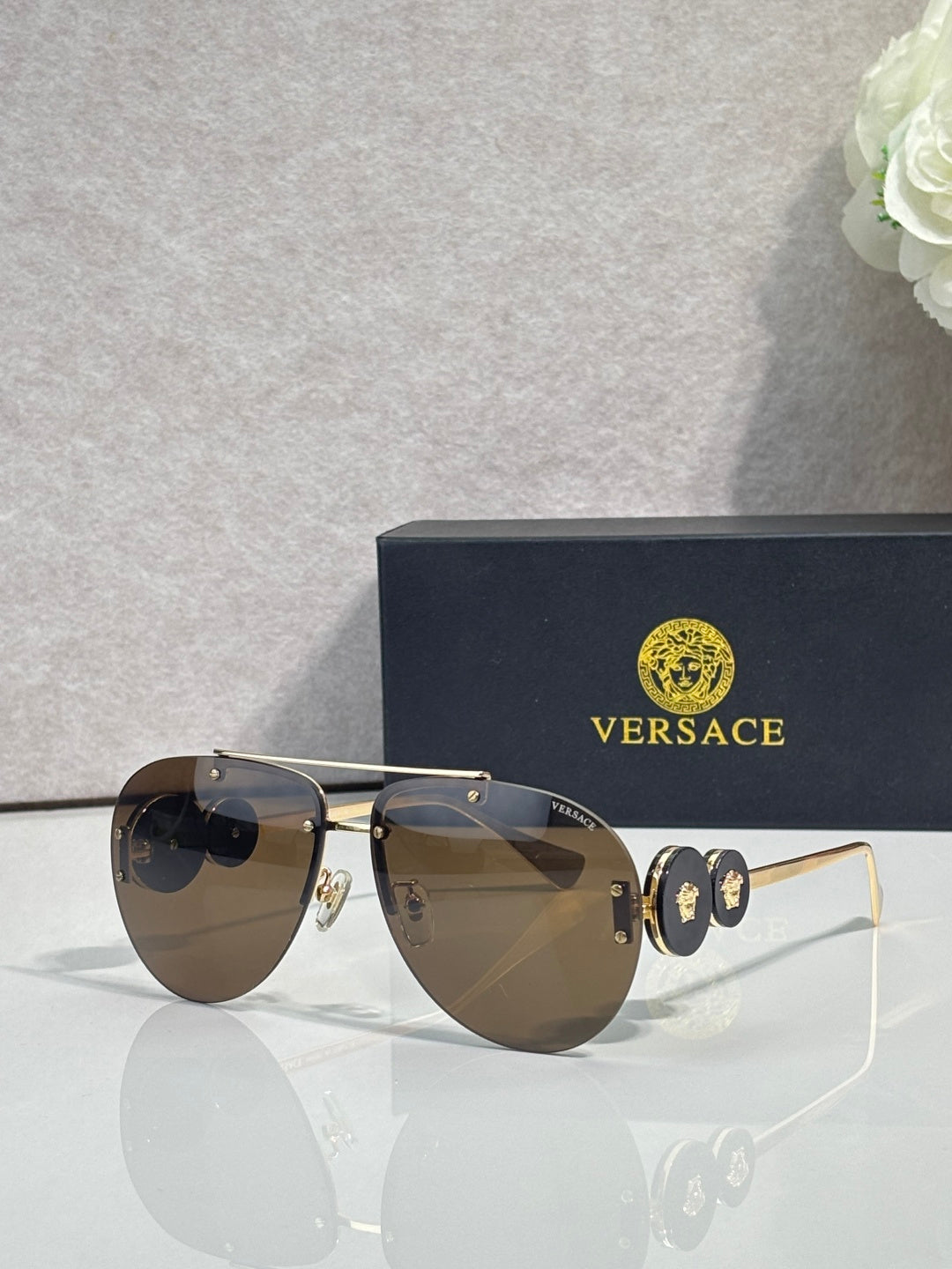 Versace pilot sunglasses, dark tinted lenses, gold-tone metal frame