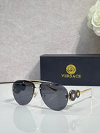 Versace pilot sunglasses, deep blue tinted lenses, gold-tone metal frame