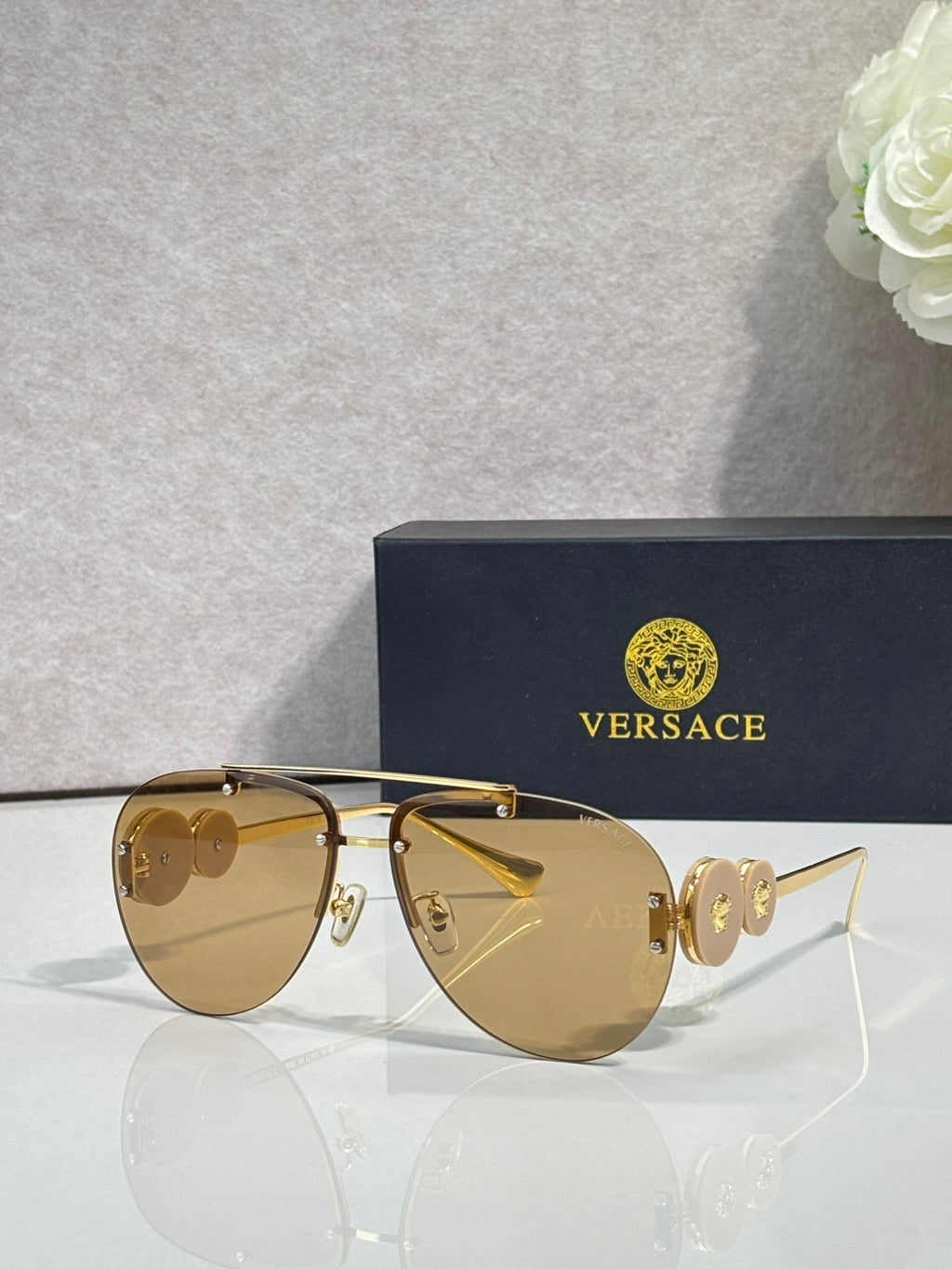 Versace pilot sunglasses, amber tinted lenses, gold-tone metal frame