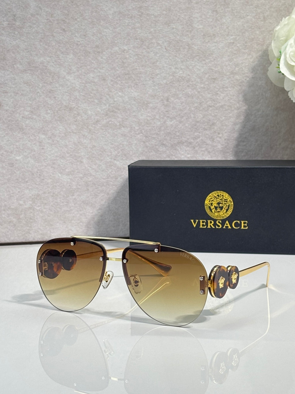 Versace pilot sunglasses, light amber tinted lenses, gold-tone metal frame