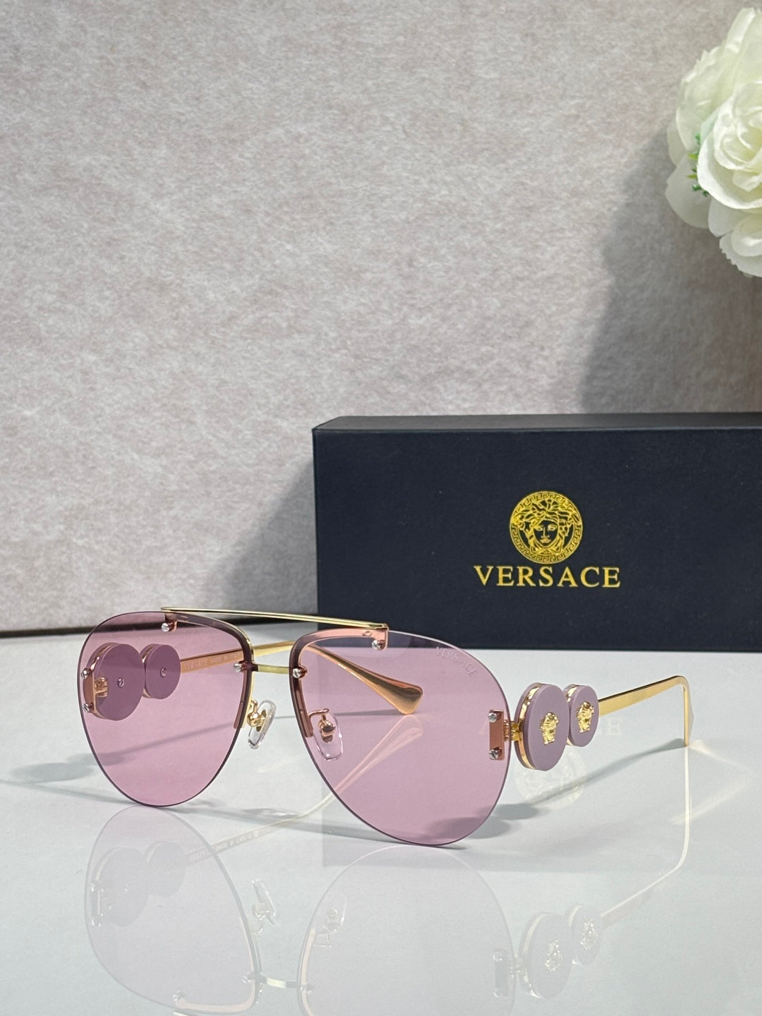 Versace pilot sunglasses, pink tinted lenses, gold-tone metal frame