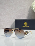 Versace pilot sunglasses, blue tinted lenses, gold-tone metal frame