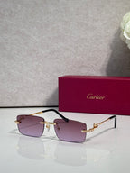 Cartier eyeglasses with purple-tinted lenses, gold frame, and blue crystal accents.