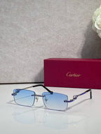 Cartier eyeglasses with light blue lenses, silver frame, and blue crystal accents.